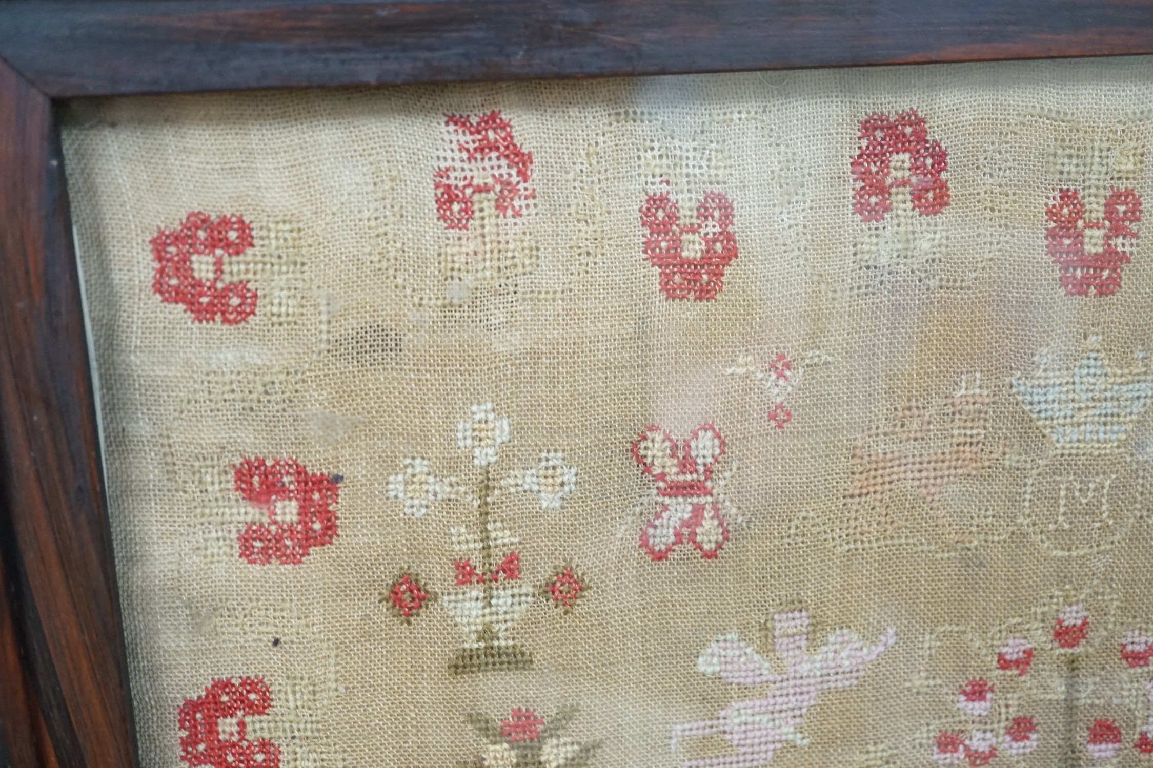 A large framed sampler, 1817, 57 x 56cm including frame